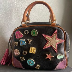 SOLD.  Dooney & Bourke Black and Pink Handbag